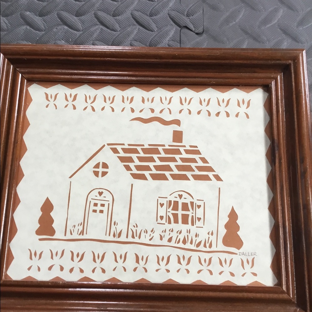 Hand cut scerenschnitte cottage design on brown